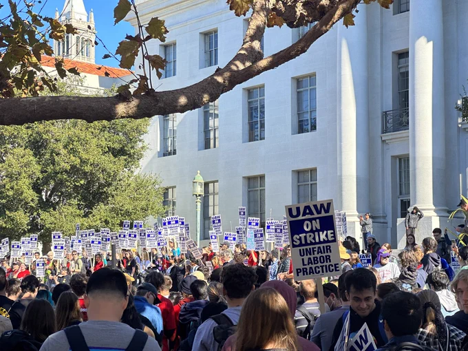 Thousands of people in front of Sproul Hall, giving remakes from the Mario Savio Steps