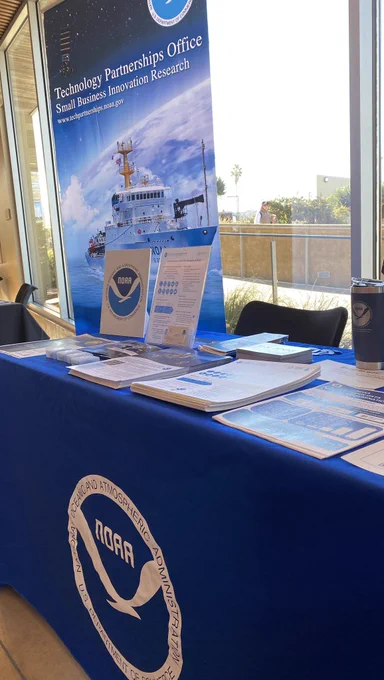 Table with blue cloth and NOAA logo