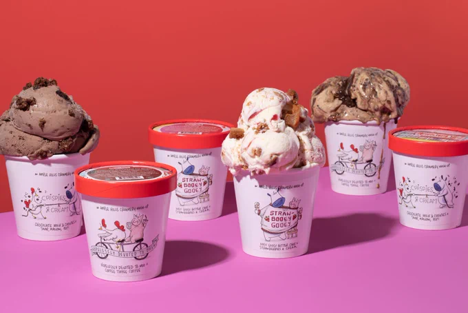 On a red and pink background, covered pints and uncovered pints with scoops overflowing of the Mash Up Collection appear.