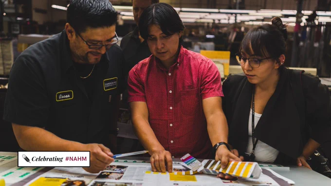 Brian Skeet and Ravenna Curley check color proofs of Turning Points Magazine's first issue at a Phoenix print shop in November 2016. They discuss the proofs with a print shop professional.