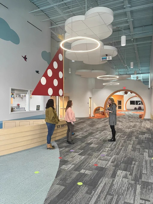 Women looking at a preschool environment