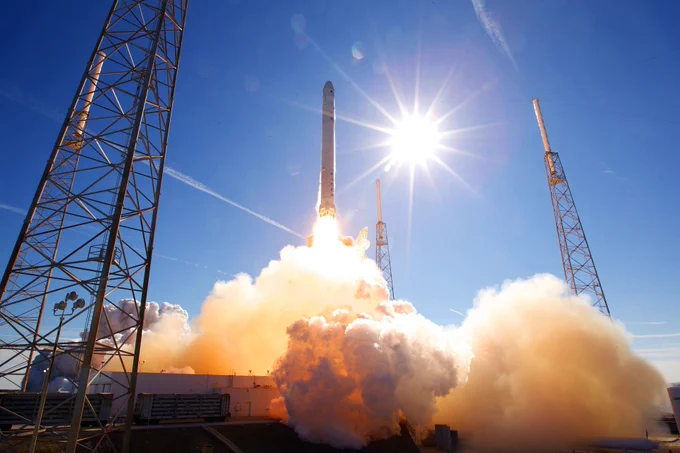 A rocket launching from the launch pad.