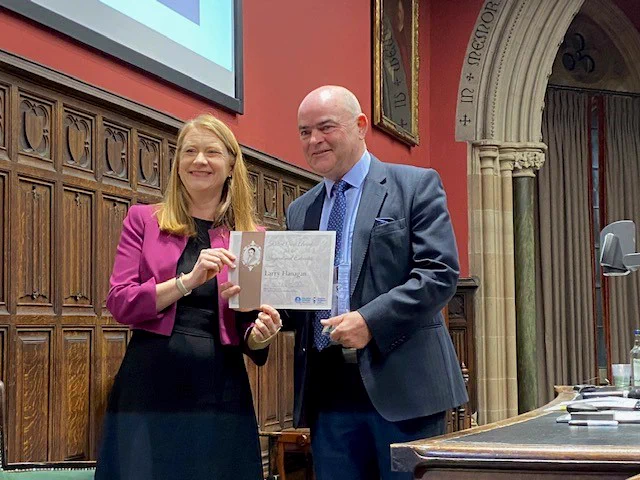 Education Secretary Shirley-Anne Somerville presenting the Robert Owen Award to Larry Flanagan