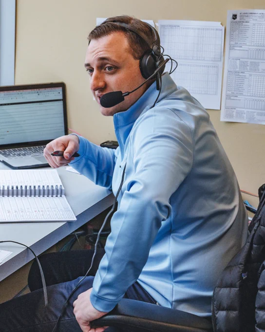 A photo of Jake Eisenberg during a broadcast at Kauffman Stadium.