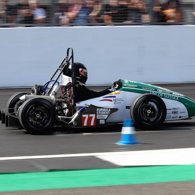 University of Sussex's green car mid-run during the acceleration course at Formula Student 2018 at Silverstone