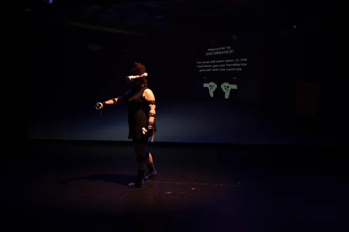 A performer using VR equipment