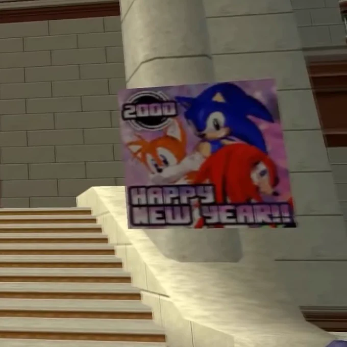 Station Square has a makeover because it's the new year! There are posters all around the train station that have Sonic, Tails, and Knuckles on them. The poster has a sonic logo in the top right with a bold pink gradient "2000" on the bottom of the poster it says "HAPPY NEW YEAR!!" in the same pink to white gradient with black outline.