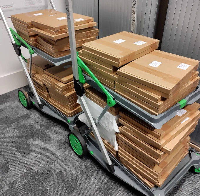 Christmas boxes for primary schools on two trolleys ready to be posted tomorrow.
