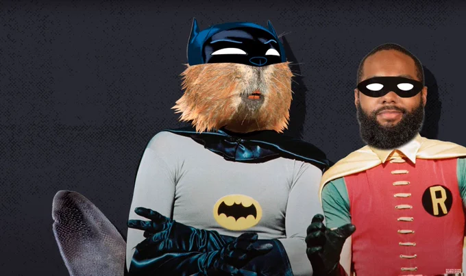 A beaver dressed at the hero Batman with Above the Noise host Myles Bess dressed as Robin.