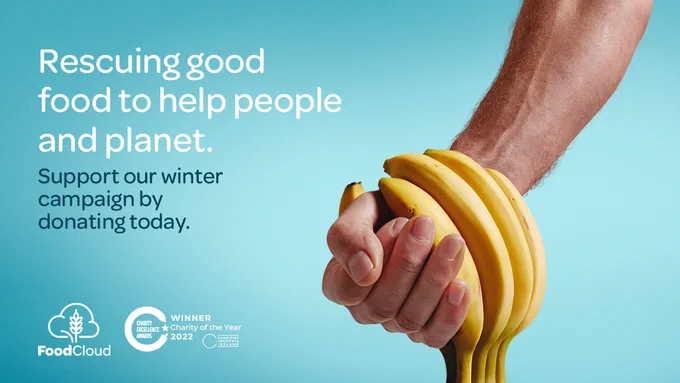 Hand holding bananas with text that reads rescuing good food to help people and planet. Support our winter campaign by donating today.