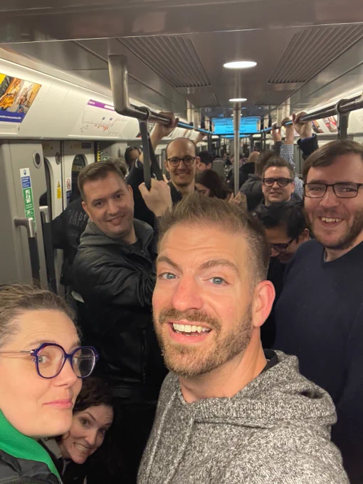 Group of developers riding the train in London