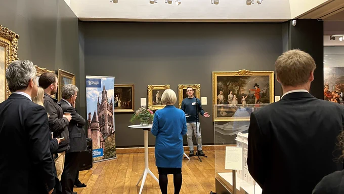 A student speaker giving a speech at the event in the Hunterian Art Gallery.