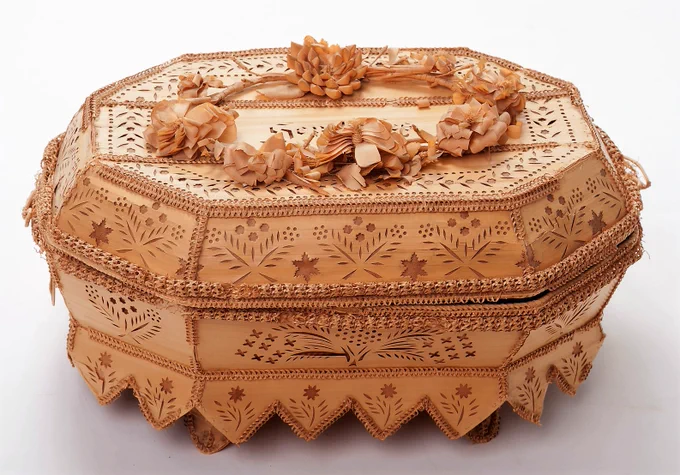 19th century work basket from the Seycelles, made of young leaflets from the coco de mer palm and heavily ornamented.