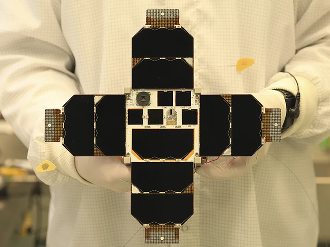 Figure 2. Photo of the MOVE-II spacecraft showing the solar array with the payload solar cells in the middle.