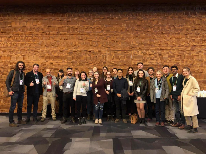 A photo of the members of the Gries Lab standing together, smiling, and holding their thumbs up at the Entomology 2022 JAM