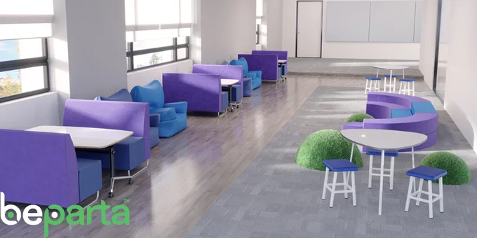 A wide corridor with furniture on either side. The furniture includes 3 grass-textured hemispheres, amphitheatre-style seating in 2 tiers which would accommodate a large group of students, 3 sets of booth-style seating, 2 triangular tables with stools and 4 large soft armchairs
