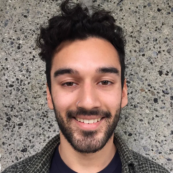 A headshot of Asim
