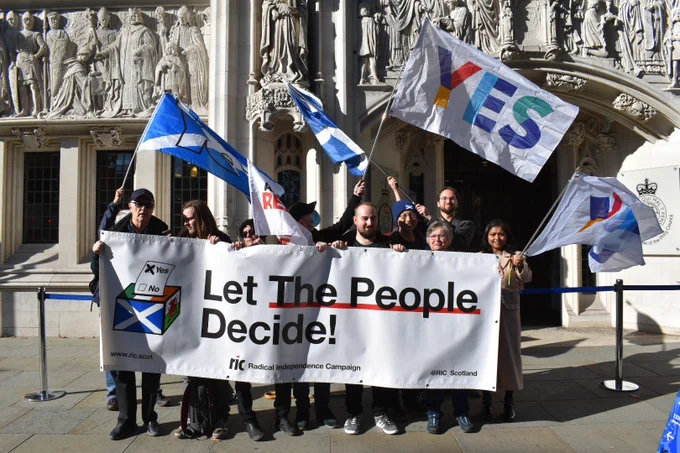 RIC supporters outside the UK Supreme Court in October with a banner reading: "Let The People Decide!"