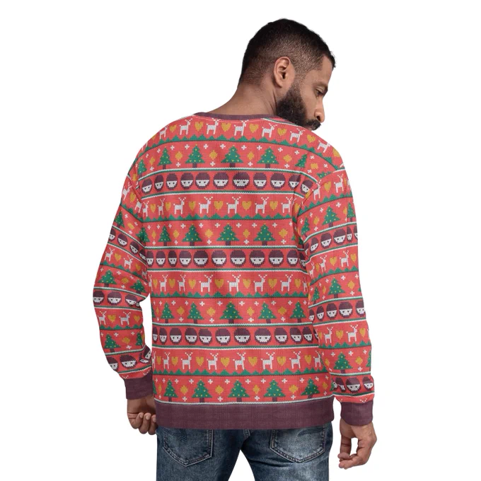 A man wearing a festive jumper with Ministry of Testing logos. 