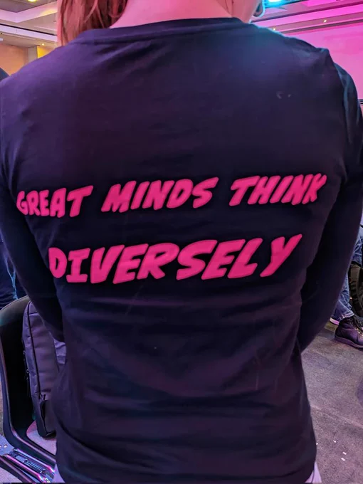Backside of a t-shirt stating: "Great minds think diversely" 