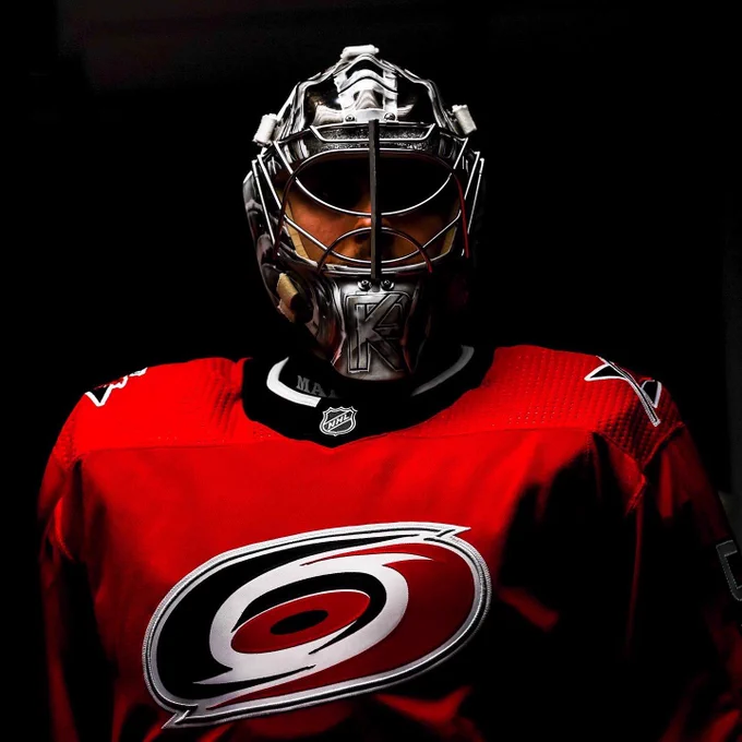 Artsy photo of Pyotr Kochetkov in this year’s red sweater with his mask on