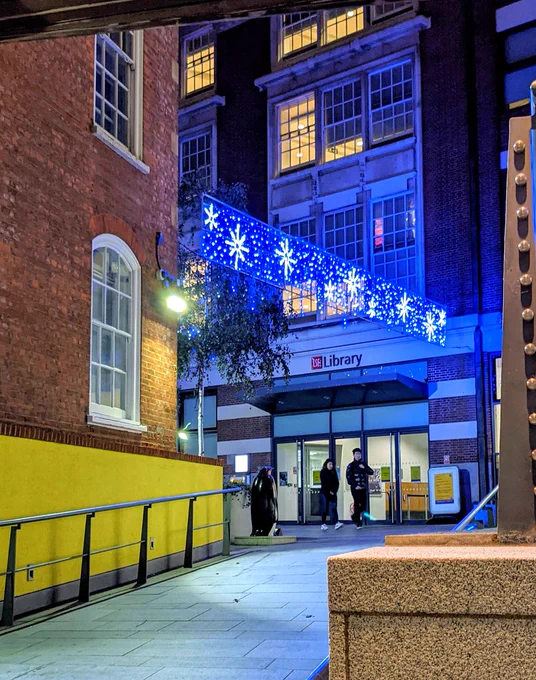 Night-time image of the Christmas lights in John Watkins Plaza, the area outside LSE Library. 