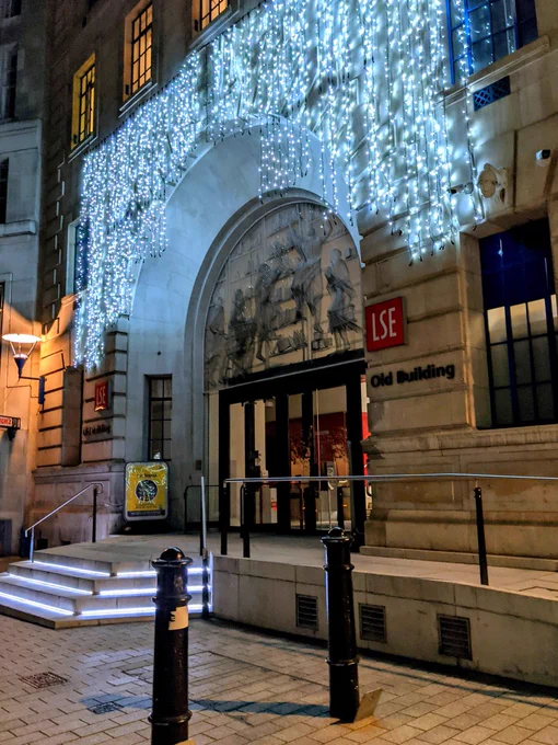 Night-time image of the Christmas lights adorning LSE's Main Entrance in Houghton Street.