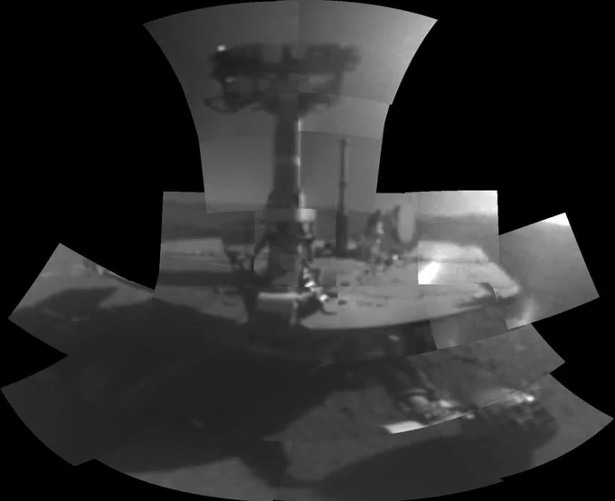 This self-portrait of NASA's Opportunity Mars rover shows the vehicle at a site called "Perseverance Valley" on the slopes of Endeavour Crater. It was taken with the rover's Microscopic Imager to celebrate the 5000th Martian Day, or sol, of the rover's mission.

The Microscopic Imager is a fixed-focus camera mounted at the end of the rover's robotic arm. Because it was designed for close inspection of rocks, soils and other targets at a distance of around 2.7 inches (7 cm), the black and white image of the rover is out of focus.

The rover's self-portrait view is made by stitching together multiple images take on Sol 5,000 and 5,006 of the mission. Wrist motions and turret rotations on the arm allowed the Microscopic Imager to acquire the mosaic's component images. The resulting mosaic does not include the rover's arm.