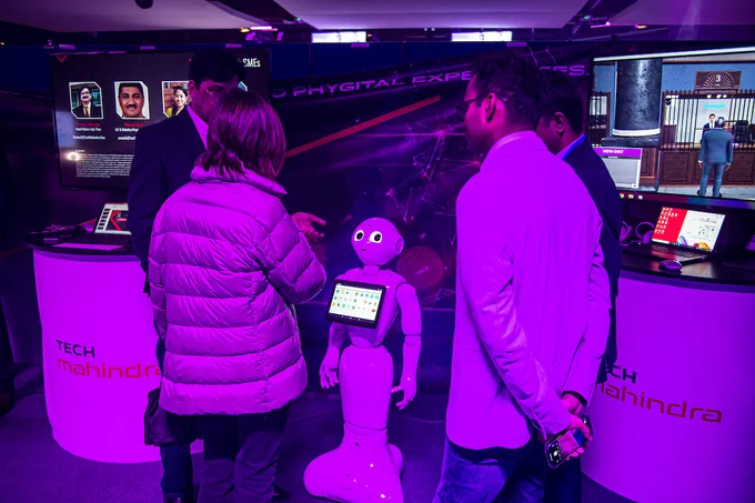 People working with a robot