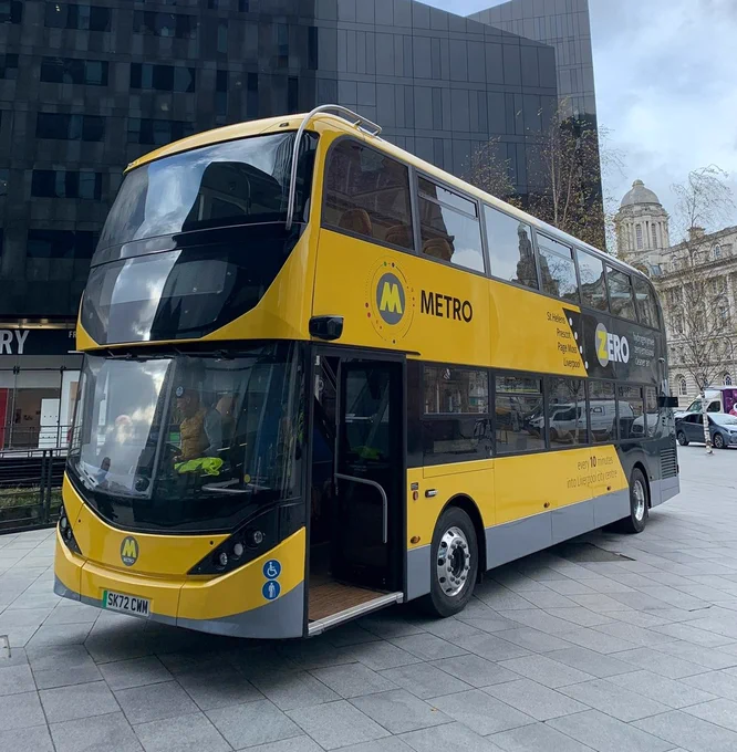 One of the brand new 'Metro' branded yellow and black hydrogen buses for the city region on display near to Liverpool waterfront