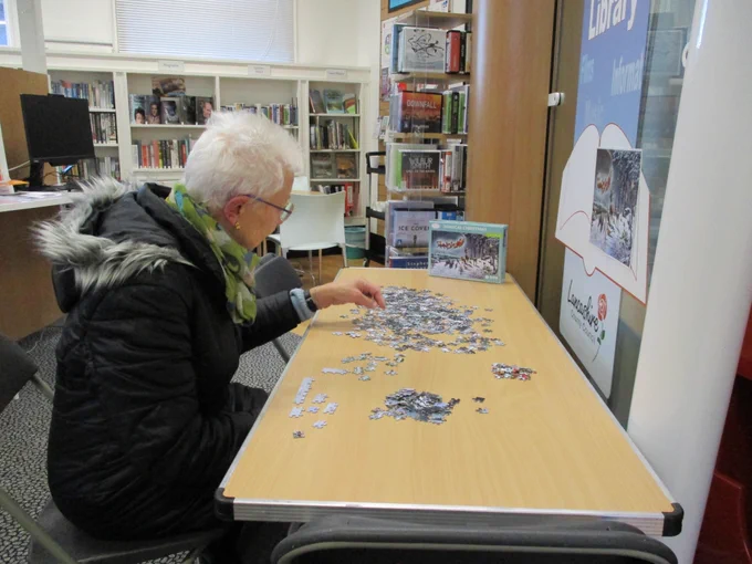 lady doing a jigsaw