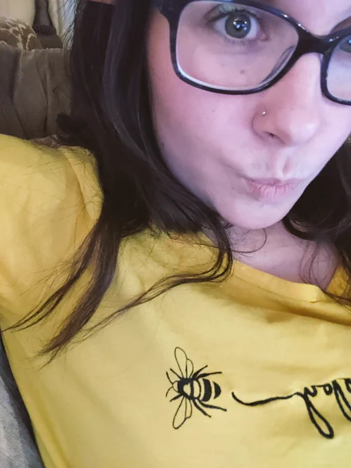 selfie of turtletickles wearing a yellow shirt with a bee on it