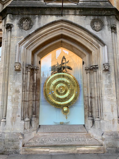 The Corpus Chronophage Clock of Corpus Christi College on the corner of Trumpington Street, King's Parade & Bene't Street. The Clock is covered in gold with a time-eater, the Chronophage, sitting on top, acting as a grasshopper escapement
