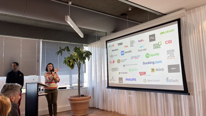 Lisa Koeman (organizer) showing a slide for where the Experience and Beyond attendees are coming from.
