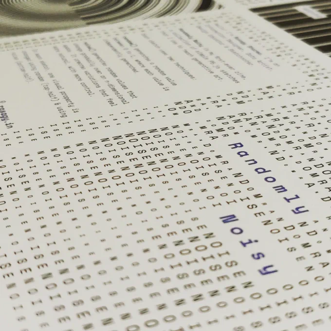 Photo of a Zine called Randomly Noisy, with patterns made using the letters from the name.