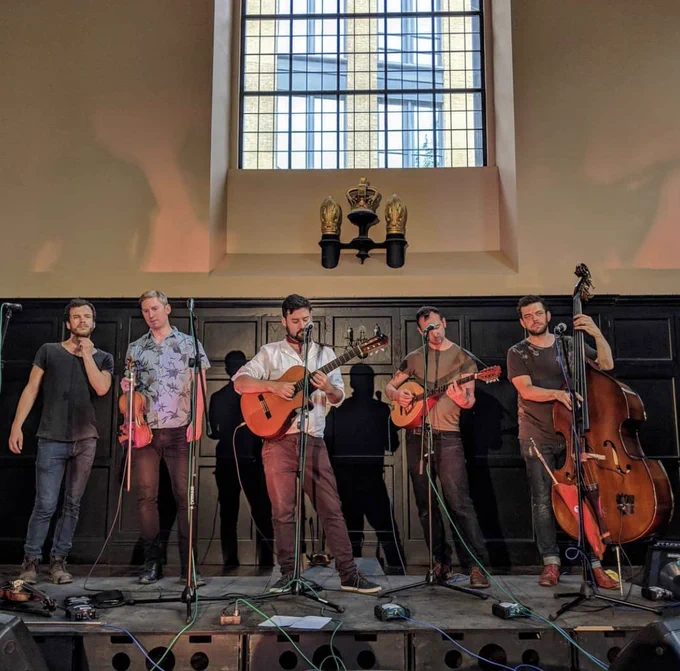 Apply of my Eye playing a live gig under a large church window