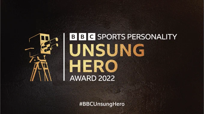 Logo for BBC Sports Personality Unsung Hero Award 2022 on a black background with white and gold writing, and a gold camera.