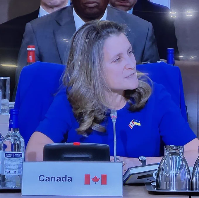 Deputy Prime Minister Chrystia Freeland is seated and delivering remarks.