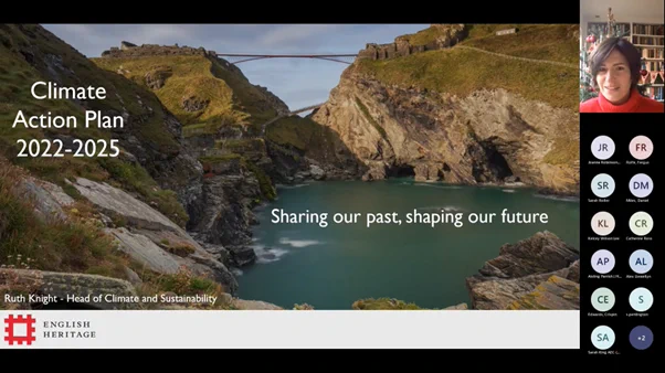 A screenshot of the webinar, showing English Heritage's opening slide which has the text "Climate Action Plan 2022-25". The image behind the main text shows the landscape at Tintagel. 