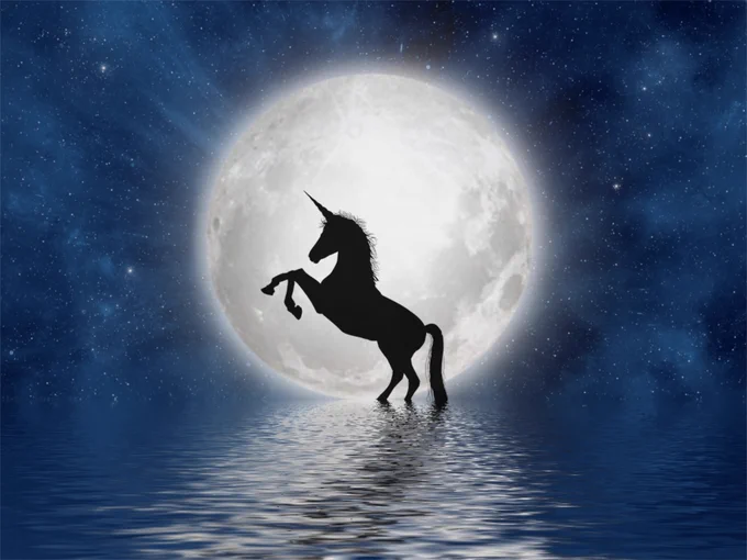  A black silhouette of a unicorn rearing in front of a full moon standing in calm water; a dark blue night sky peppered with stars in the background. 