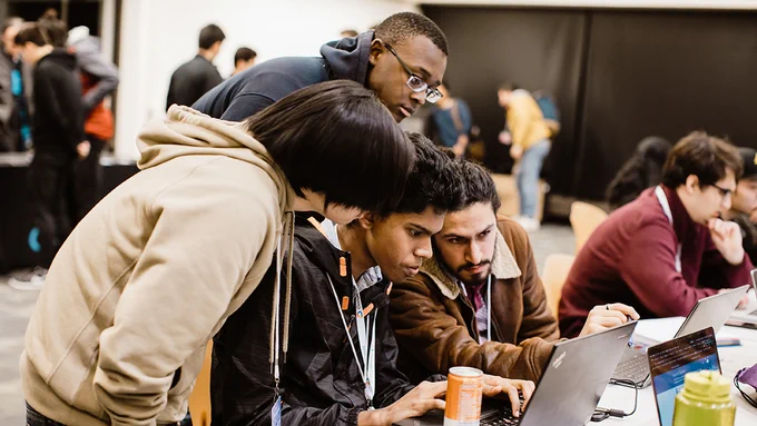 A team of students working together during a past CruzHacks event 