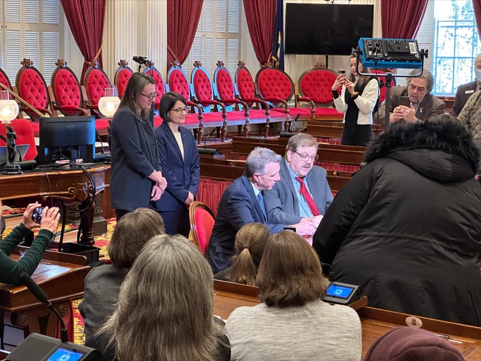 Pro Tem Balint and Speaker Krowinski look on as the Governor and Secretary of State certify the vote on the amendments