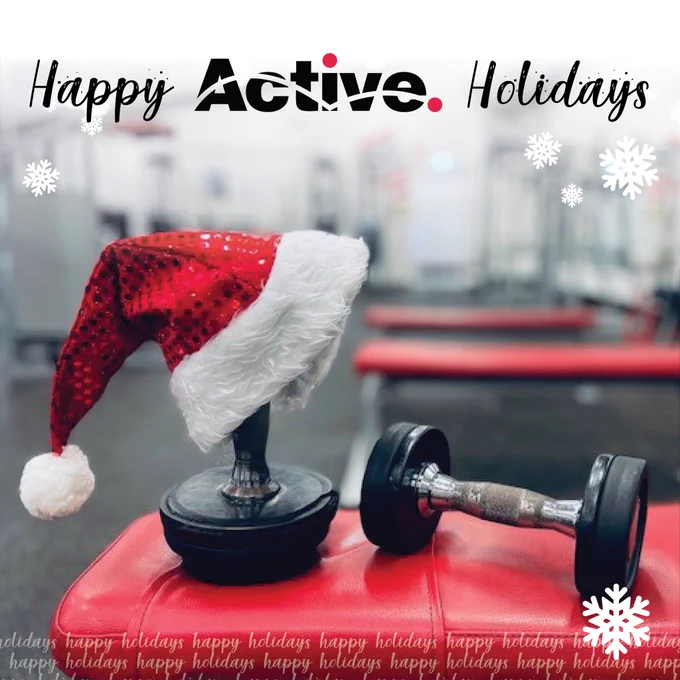 A Christmas hat on a barbell with the words Happy Active Christmas above it.  