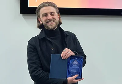 David Wilson holding teaching award
