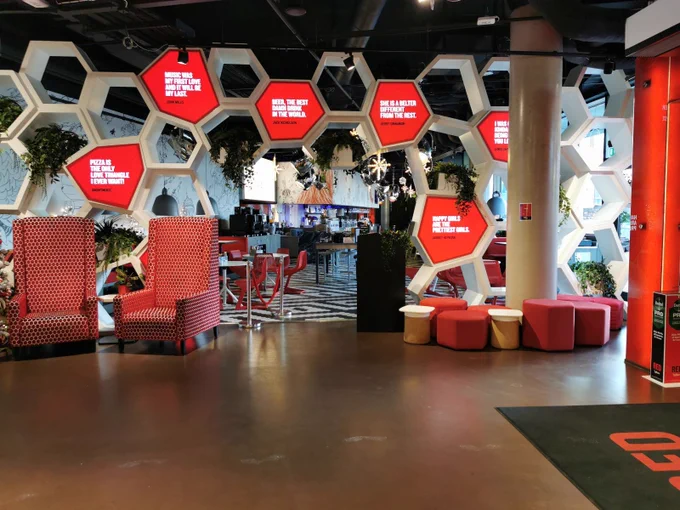 Image of inside a Raddison Red hotel foyer. 