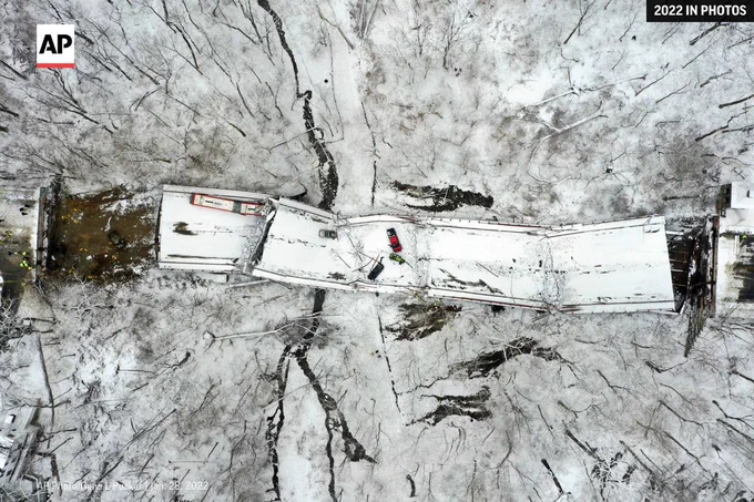 Vehicles rest on a bridge in Pittsburgh following its collapse on Jan. 28, 2022.