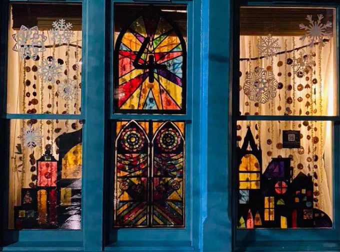 Stained glass window effect bright window with the number 4 advent number.