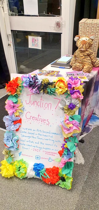A photograph of the Junction 7 Creatives welcome sign:
We are an Arts based community centre in the heart of Stevenage New Town, working with local artists and the council to make creative things happen in our town!