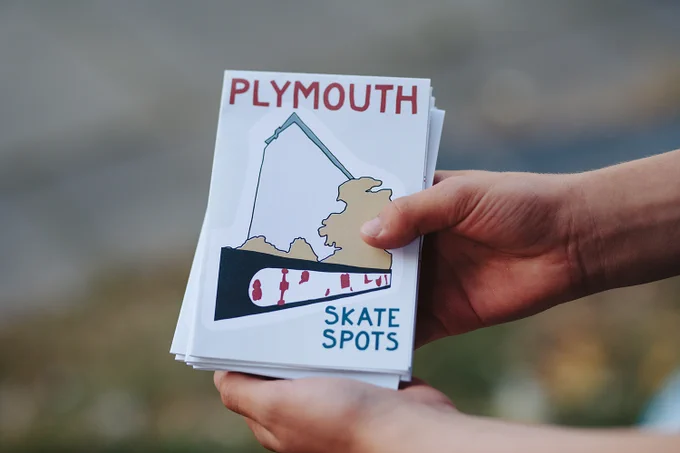 hands hold a copy of Plymouth Skate Spots map