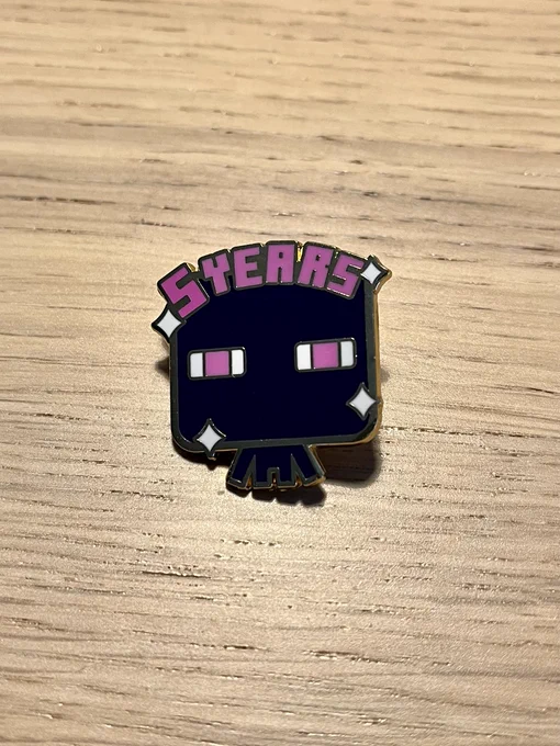 The Mojang Studios 5 year work anniversary enamel pin—chibi-like enderman with pink “5 years” text.